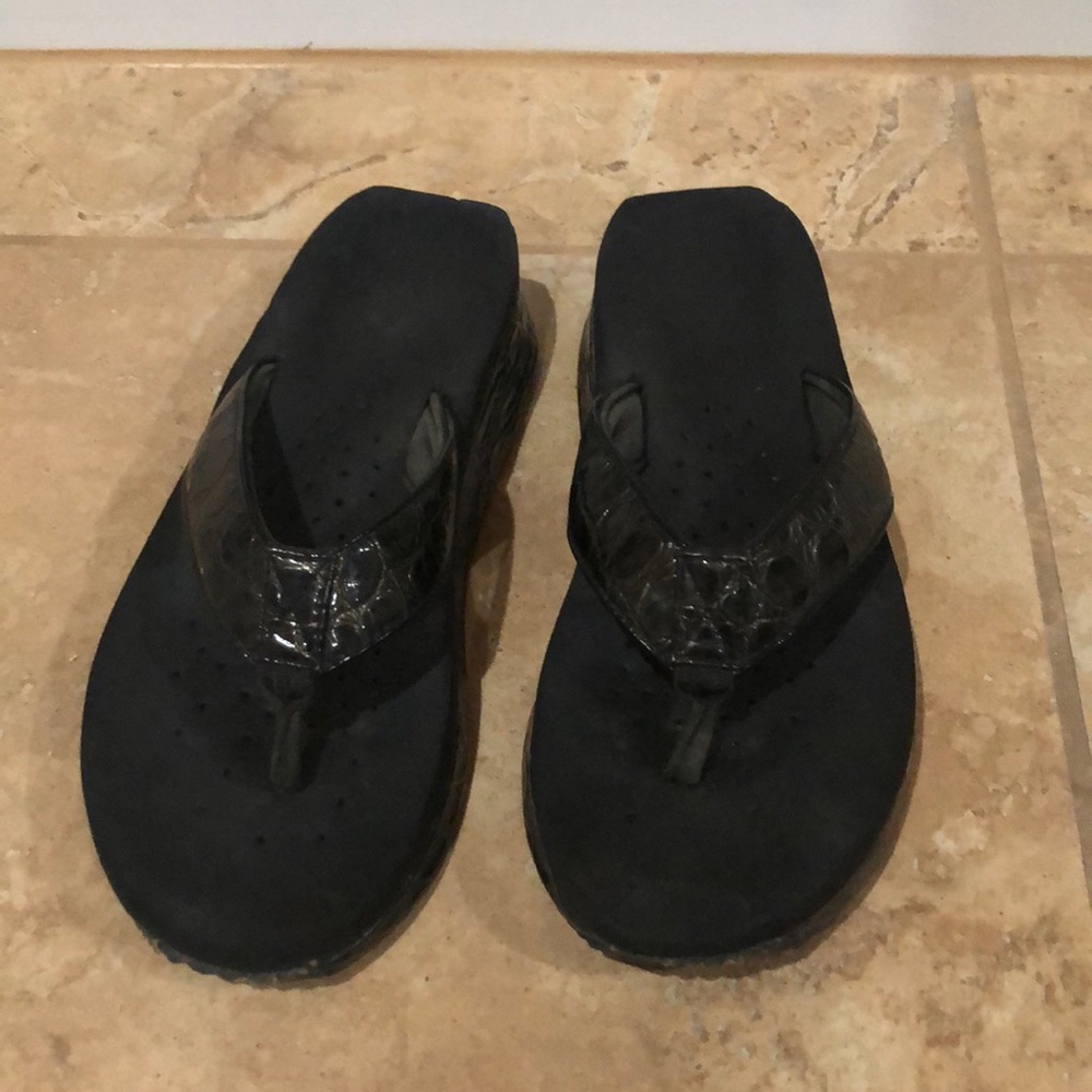 Volatile black flip flops